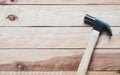 Hammer on wood background. Top view with copy space. Royalty Free Stock Photo