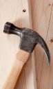 Hammer on a wood plank background Royalty Free Stock Photo