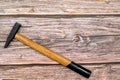 Hammer on a wooden table. Locksmith work table with tools in the workshop. Flat lay with copy space. Royalty Free Stock Photo