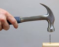 Hammering in a Nail Royalty Free Stock Photo