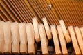 Hammers and strings inside piano. Part of internal mechanism.