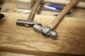 Hammers are on a wooden table. Royalty Free Stock Photo