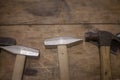 Hammers are on a wooden table. Royalty Free Stock Photo