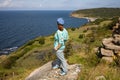 Hammershus - Bornholm, ruins of an old castle, Female tourist admiring the beautiful landscape.