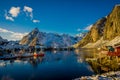 HAMMNOY, LOFOTEN, NORWAY, APRIL, 10, 2018: Above view of some Fishing hut rorbu and Lilandstinden mountain peak at Royalty Free Stock Photo