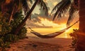 Hammock on beach at beautiful sunset near ocean shore attached to a palm tree. Caribbean vacation Royalty Free Stock Photo