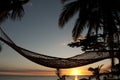 Hammock on beach at sunset in Fiji Islands