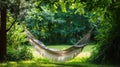 Hammock for a cozy rest in the shade of trees Royalty Free Stock Photo