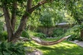 Hammock in the garden with green plants and trees. Summer time Royalty Free Stock Photo