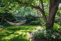 Hammock in the garden with green plants and trees. Summer time Royalty Free Stock Photo