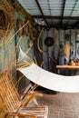 Hammock hanging on wooden deck in backyard. place to relax in fresh air Royalty Free Stock Photo