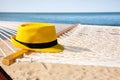 Hammock and hat at seaside. Time to Royalty Free Stock Photo
