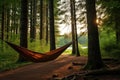 hammock hung between trees in a campsite Royalty Free Stock Photo