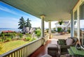 Hammock and patio area with armchairs at the wooden walkout porch