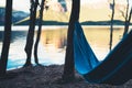 Hammock for relax on background of nature lake, chilling outdoor, traveler recreation mountain landscape; camping lifestyle; enjoy