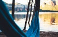 Hammock for relaxing on background of nature lake, chilling outdoor, traveler recreation mountain landscape; enjoy weekend holiday