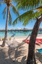 Hammock on tropical beach of Moorea Island. Royalty Free Stock Photo