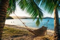 Hammock between two palm trees on the beach at sunset Royalty Free Stock Photo