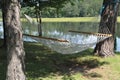 A hammock between two trees Royalty Free Stock Photo