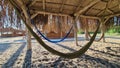 Hammock under natural canopy on the sand beach Royalty Free Stock Photo