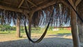 Hammock under natural canopy on the sand beach Royalty Free Stock Photo