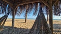 Hammock under natural canopy on the sand beach Royalty Free Stock Photo