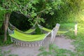 hammocks hang in the shade of trees Royalty Free Stock Photo