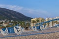 Hammocks stacked on Albir beach at sunrise Royalty Free Stock Photo