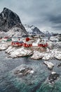 Lofoten Islands, Reine, Norway. Hamnoy fishing village with red fishing huts rorbu in winter. Royalty Free Stock Photo