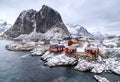 Lofoten Islands, Reine, Norway. Hamnoy fishing village with red fishing huts rorbu in winter. Royalty Free Stock Photo