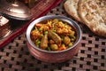Hamour Curry or Hammour Curry with mixed vegetables and bread served in dish isolated on table side view of middle east food