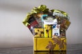 Hamper with various products wrapped in gold colour for Hari Raya Aidilfitri celebration. Royalty Free Stock Photo