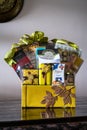 Hamper with various products wrapped in gold colour for Hari Raya Aidilfitri celebration.