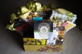 Hamper with various products wrapped in gold colour for Hari Raya Aidilfitri celebration.