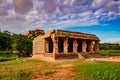 Hampi ruins ancient breathtaking stone art with bright blue sky flat angle shot