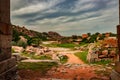 Hampi ruins antique stone art from unique angle with amazing sky