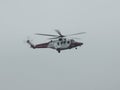 Hampshire coastguard helicopter landing at the Solent Airport, UK on a cloudy day