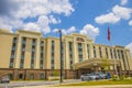 Hampton Inn & Suites front building view with blue skies and clouds Royalty Free Stock Photo