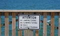 A warning sign on the pier off Buckroe Beach that do not allow jumping, diving,
