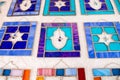 Hamsa and David Star stained glass plates sold at handicraft market. Tel-Aviv Royalty Free Stock Photo