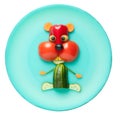 Hamster made of vegetables on green plate