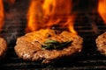 Hamuburgers cooking on grill. lamb burgers spiced by mint and lamb rub on bbq grill Royalty Free Stock Photo