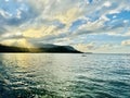Sunset Embrace: Hanalei Bay\'s Radiant Waters and Canoe Under Na Pali Ridges Royalty Free Stock Photo