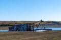 Hancock, Michigan - October 18, 2021: The famous Quincy Dredge Number Two sits abandoned in a marsh on the Keweenaw Peninsula