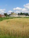 Summer splendor at Hancock Shaker round barn and grain field Royalty Free Stock Photo