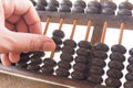 Hand and ABACUS old antique calculator retro finance education , Royalty Free Stock Photo