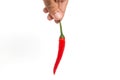 Hand from above holding a big red chili on white background Royalty Free Stock Photo