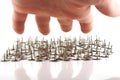 Hand above thumb tacks - drawing pins Royalty Free Stock Photo