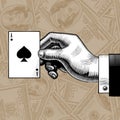Hand with the ace of Spades playing card on the dollars bank not