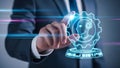 Hand activating artificial intelligence system through gear icon. Royalty Free Stock Photo